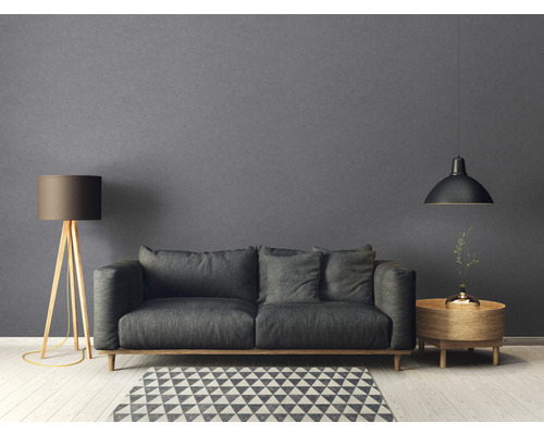 Wohnzimmer mit Sofa, Stehlampe und Pendelleuchte