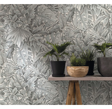 Papier peint à motif de plantes et plantes en pot sur une table