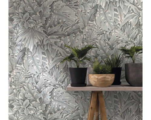 Papier peint à motif de plantes et plantes en pot sur une table