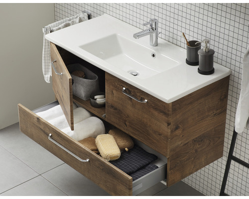 Waschtischunterschrank aus Holz mit offenem Schubfach und Tür im Badezimmer