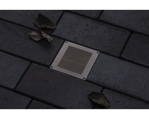 Spot encastrable au sol avec recouvrement dans des pavés