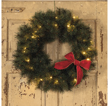 Couronne de Noël avec nœud et éclairage