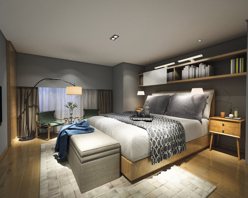 Chambre claire avec lit, table de chevet et siège