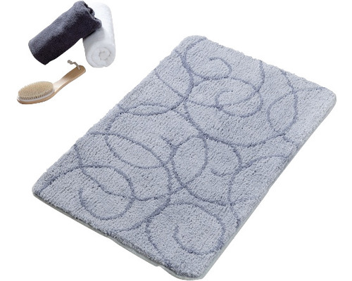 Tapis de bain gris avec motif circulaire, serviettes et brosse pour le corps