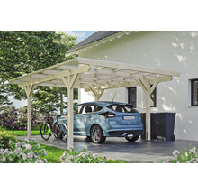 Voiture sous un abri de voiture en bois à côté d''une maison et d''un vélo