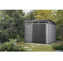 Abri de jardin en plastique avec double porte dans le jardin