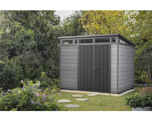 Abri de jardin en plastique avec double porte dans le jardin