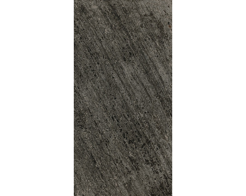 Surface en béton grise avec une texture rugueuse.