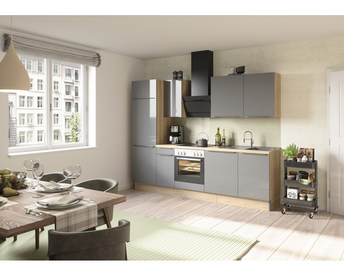 Cuisine lumineuse avec table à manger et armoires de cuisine grises