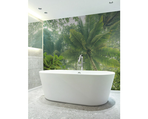 Salle de bains avec baignoire îlot et papier peint photo avec motif de palmiers