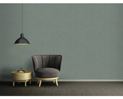 Intérieur avec fauteuil, lampe, mur et table d''appoint