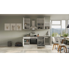 Cuisine claire avec placards intégrés, évier, lave-vaisselle et table à manger