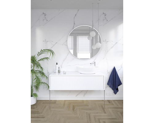 Salle de bain lumineuse avec meuble-lavabo, miroir rond et plante d''intérieur pour une ambiance conviviale