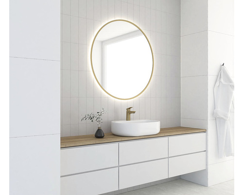Salle de bain moderne avec miroir rond, lavabo et robinet