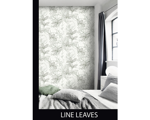 Chambre à coucher avec papier peint à motif de feuilles