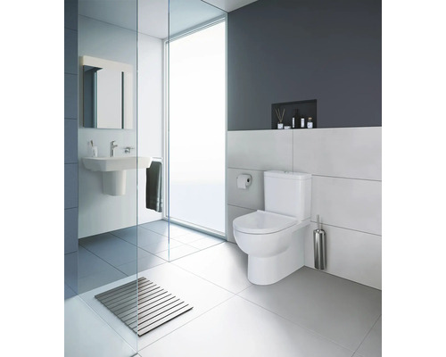 Modernes Badezimmer mit Toilette, Waschbecken und Dusche.