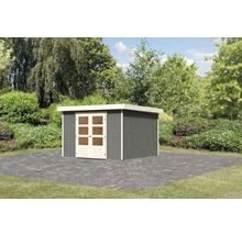 Abri de jardin en bois avec porte double devant un espace vert