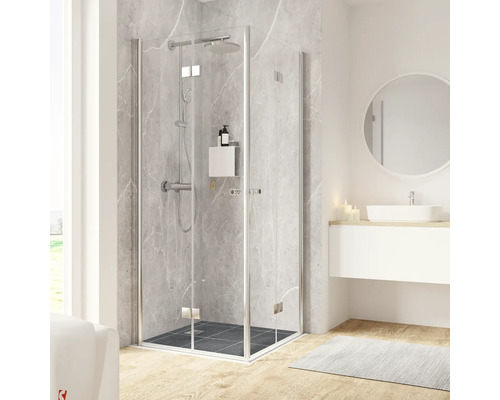 Douche accès d'angle avec porte à vantaux pliants et tournants SCHULTE Garant 2.0 ExpressPlus 90 x 90 cm profilé chrome verre transparent revêtement de verre résistant à la saleté tirant gauche tirant droite poignée bouton montage sur carrelage Scène de salle de bain avec cabine de douche, lavabo et miroir