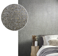 Chambre à coucher avec papier peint textile gris sur le mur