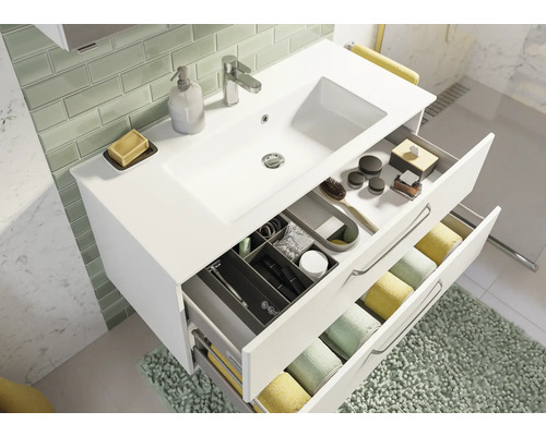 Meuble sous-lavabo avec tiroirs et lavabo dans une salle de bain moderne