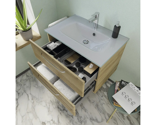 Meuble sous-lavabo avec deux tiroirs ouverts, lavabo et robinetterie