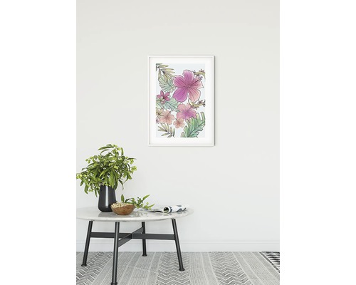 Tableau mural encadré avec motifs floraux au-dessus d''une table