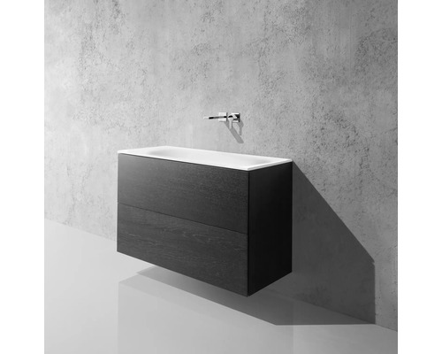 Waschtischunterschrank mit zwei Schubladen und Aufsatzwaschbecken vor einer Betonwand