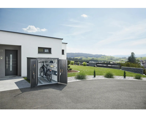 Box à vélos en métal avec portes ouvertes à côté d''une maison moderne