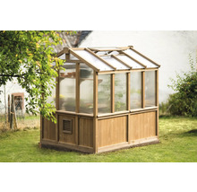 Serre de jardin en bois avec revêtement transparent dans le jardin