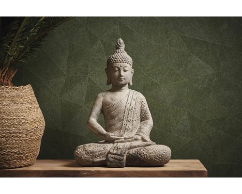 Statue décorative de Bouddha en pierre sur une table en bois