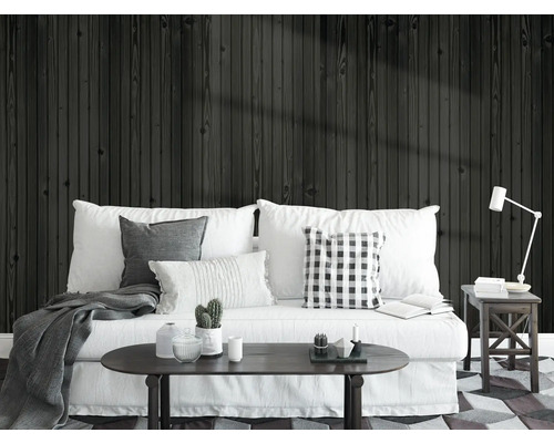 Séjour avec canapé, table et revêtement mural en bois