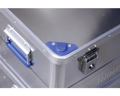 Vue détaillée d''une valise de transport en aluminium avec poignée, protection d''angle et fermeture