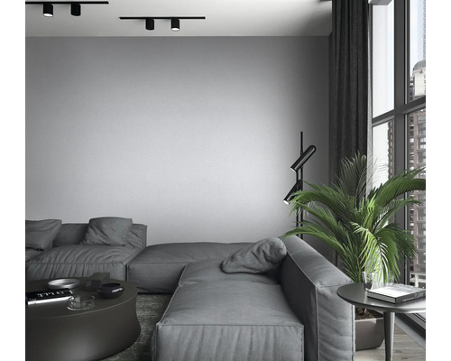 Wohnzimmer mit modularem Sofa, Stehlampe und Schienenstrahler