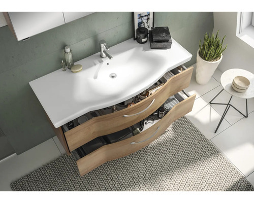 Salle de bains moderne avec meuble sous-lavabo avec tiroirs et vasque à poser blanche.