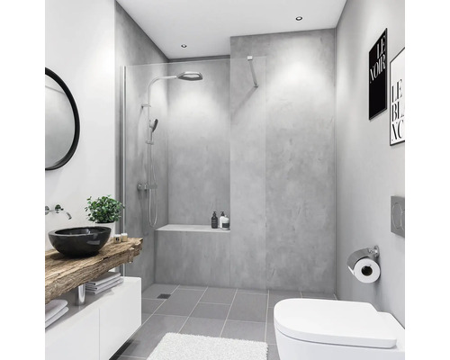 Salle de bain moderne avec douche, lavabo, miroir et toilettes.
