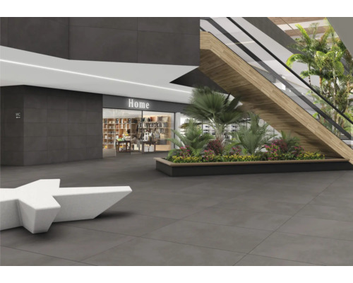 Sol carrelé dans un centre commercial avec des sièges, un escalator et des décorations florales