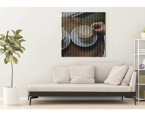 Salon avec canapé et tableau mural sur le thème du café