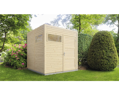 Abri de jardin en bois avec fenêtre et porte dans le jardin