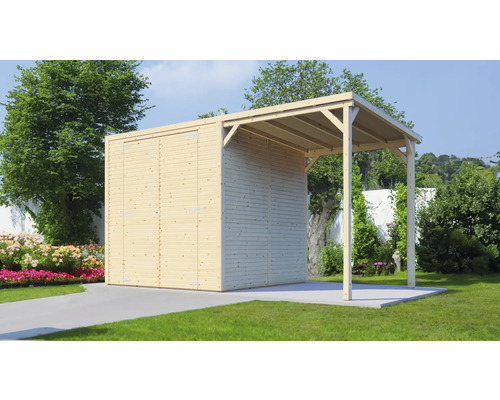 Abri de jardin en bois avec abri voiture dans le jardin.