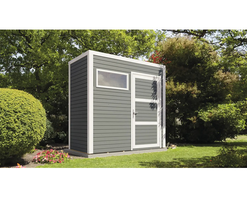 Abri de jardin en bois avec fenêtre et porte dans le jardin