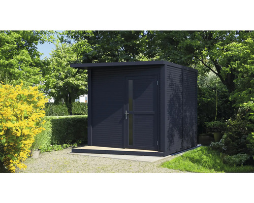 Abri de jardin avec toit plat et porte dans un jardin verdoyant