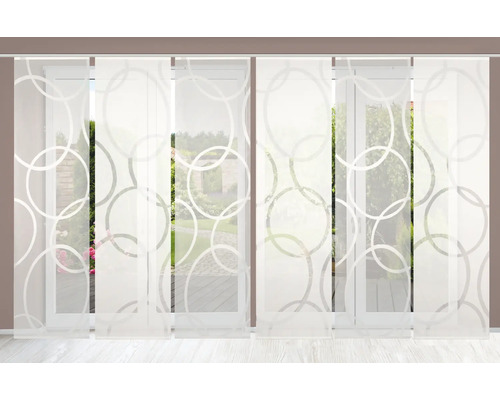 Panneaux japonais avec motif de cercles devant la fenêtre