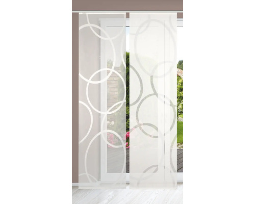 Panneau coulissant avec motif à cercles devant une porte de terrasse