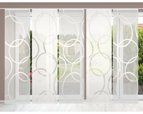 Panneau coulissant avec motif de cercle devant une fenêtre