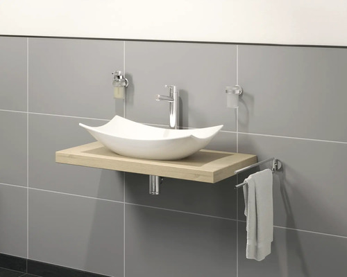 Waschtisch mit Aufsatzwaschbecken, Armatur und Handtuchhalter im Badezimmer