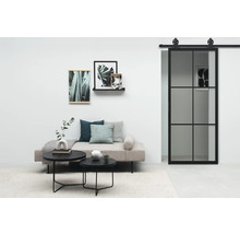 Salon avec lit de jour, table basse et porte coulissante