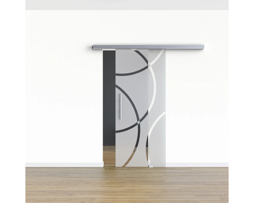 Porte coulissante en verre avec motif circulaire devant un mur blanc