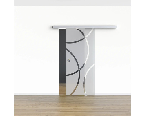 Porte coulissante en verre avec motif circulaire devant un mur blanc