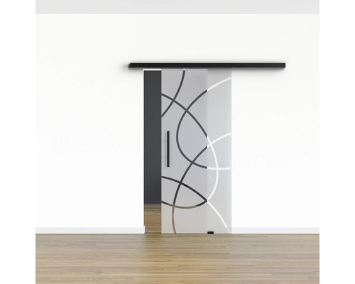 Porte coulissante en verre avec motif devant un mur blanc