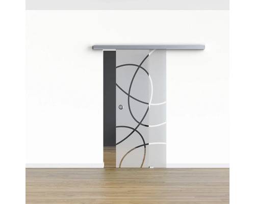 Porte coulissante en verre avec motif circulaire devant un mur blanc